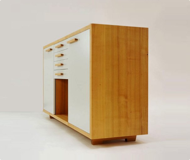 Custom wooden cabinet with white drawers and doors on a light background.